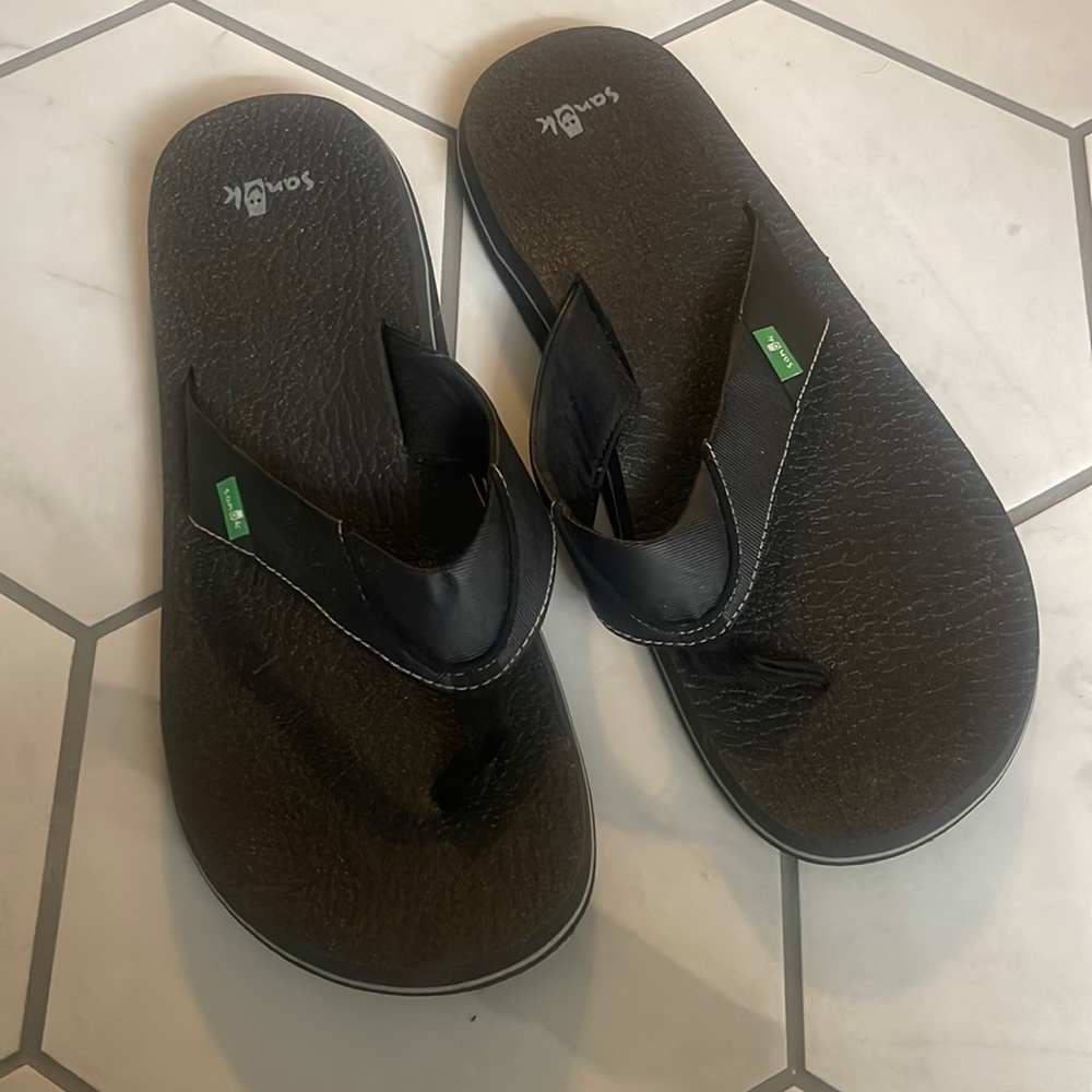 Worn once men’s sandals, they were bought too big